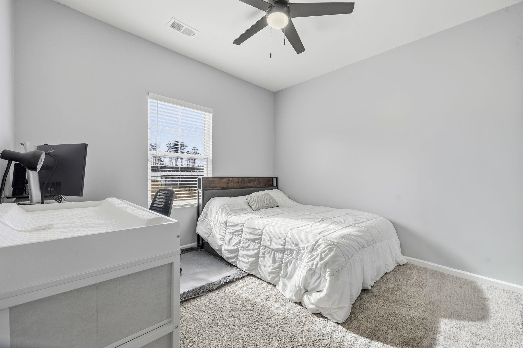 1010 Log Cabin Road Loris, SC 29569 - Photo 18 of 40 Bedroom featuring carpet flooring and ceiling fan
