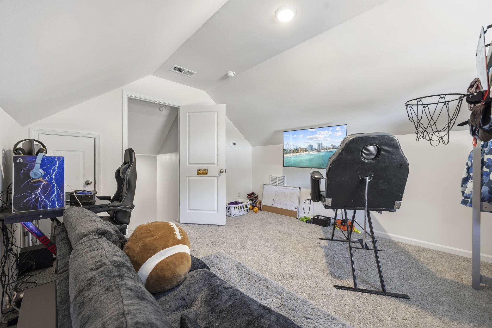 1010 Log Cabin Road Loris, SC 29569 - Photo 22 of 40 Recreation room with carpet flooring and vaulted ceiling