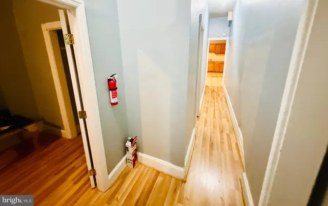 a view of a hardwood floor with a sink