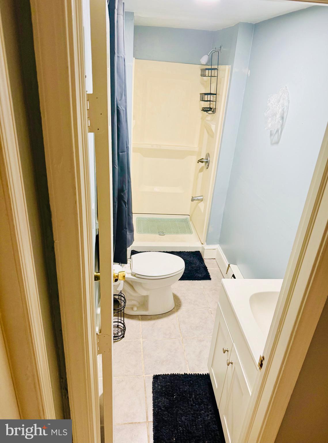 1328 North 54th Street, Unit 1 Philadelphia, PA 19131 - Photo 6 of 6 a bathroom with a sink and a toilet