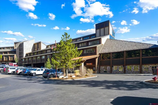 a front view of a house with a street