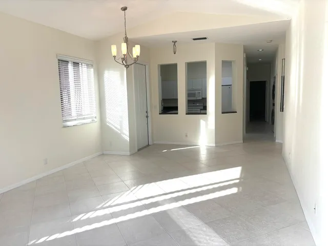a bedroom with a bed and flat screen tv