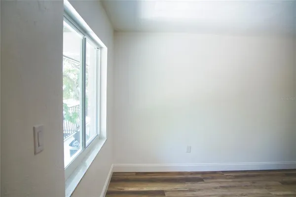 a view of an empty room and window
