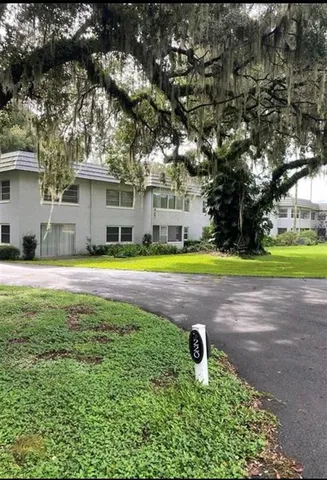 a swimming pool with outdoor seating and yard