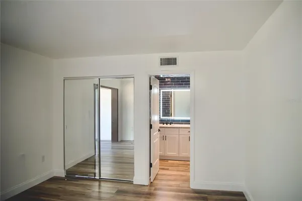 a view of entryway with wooden floor