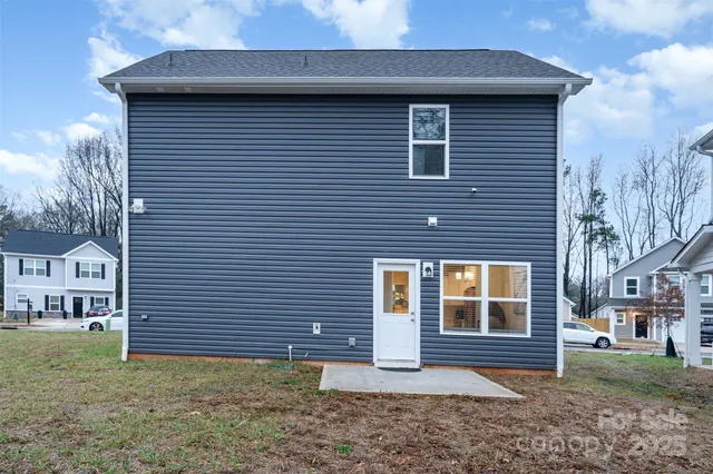 a view of a house with a yard and plants