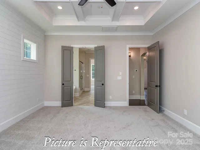 a spacious bathroom with a granite countertop sink and a mirror