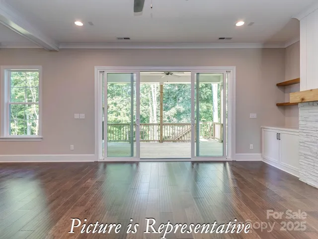 a kitchen with kitchen island a stove a counter top space and cabinets