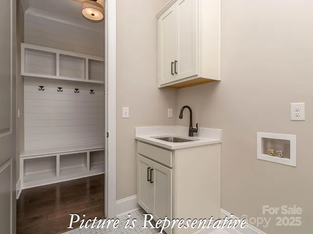 an empty room with a window and a ceiling fan