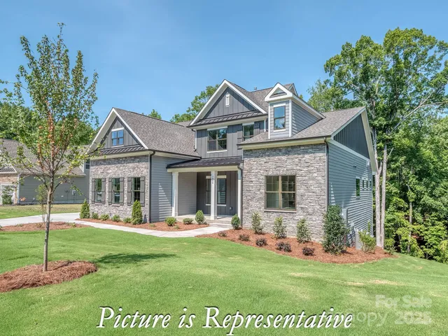 a view of a house with a yard and porch