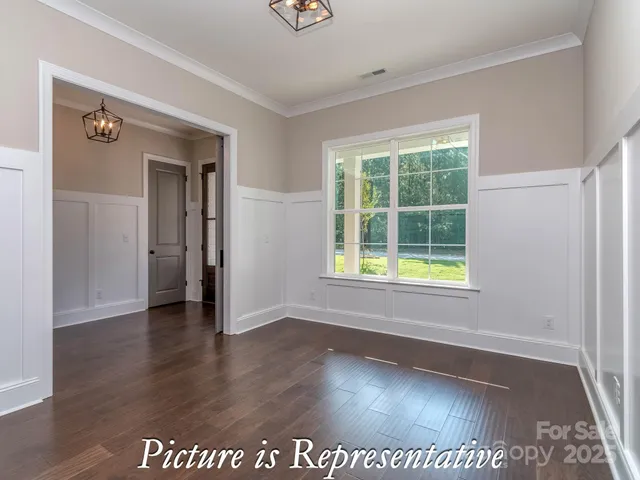 a view of wooden floor in an empty room