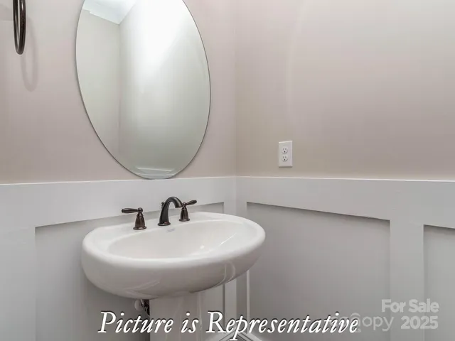 a bathroom with a sink and mirror