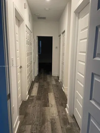 a view of a bathroom from the hallway