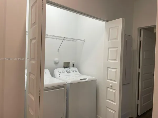 a utility room with dryer and washer