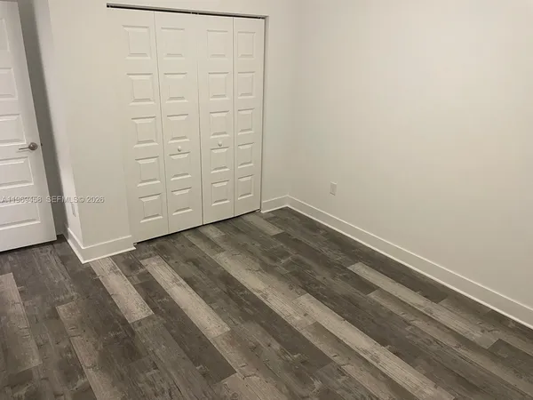 an empty room with cabinet