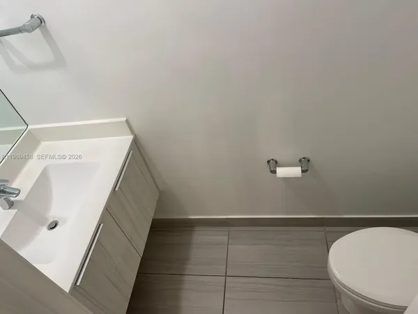 a bathroom with a sink and toilet
