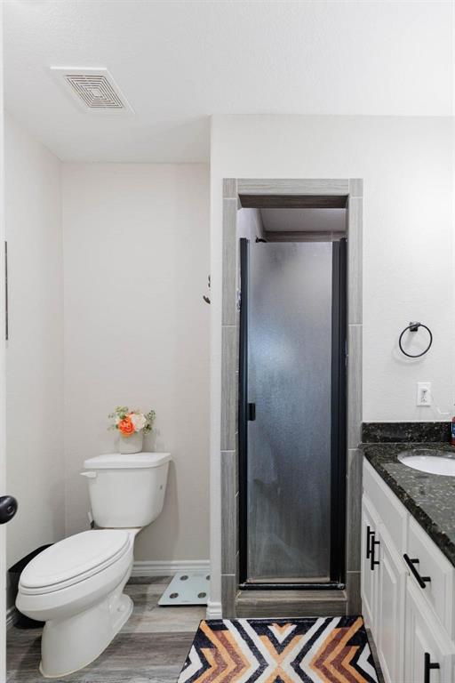 8615 North Fm 51 Decatur, TX 76234 - Photo 20 of 26 a bathroom with a granite countertop sink mirror vanity and toilet