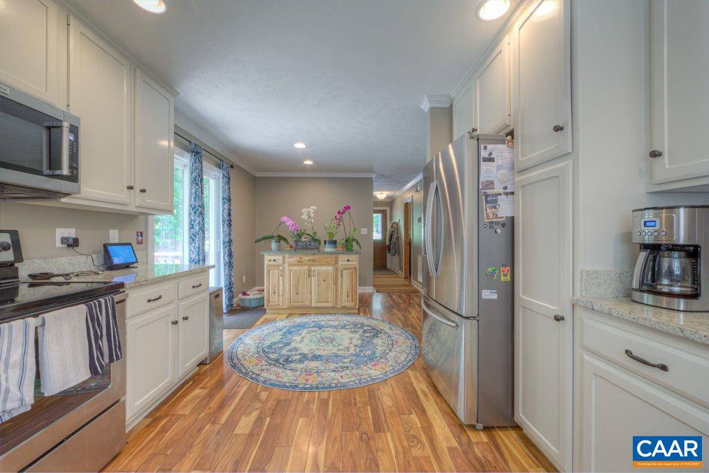 2959 Martin Kings Road Charlottesville, VA 22902 - Photo 13 of 44 a kitchen with cabinets and wooden floor