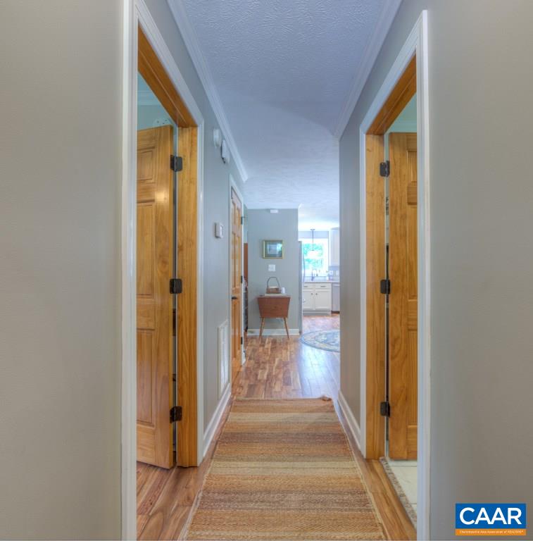 2959 Martin Kings Road Charlottesville, VA 22902 - Photo 14 of 44 a view of a hallway with wooden floor