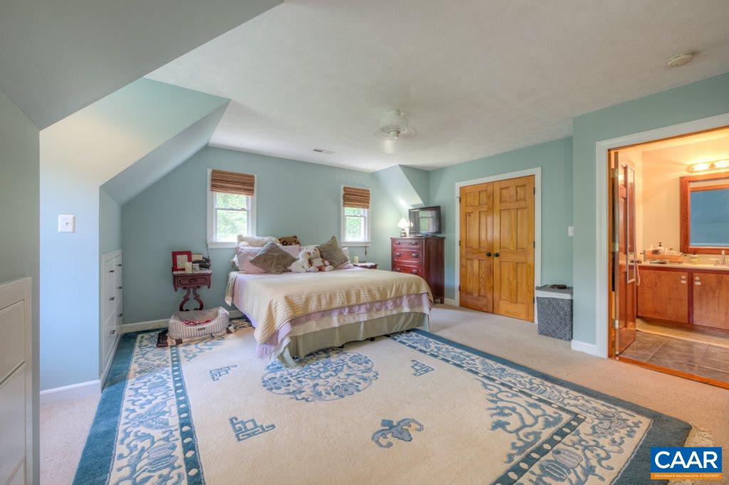 2959 Martin Kings Road Charlottesville, VA 22902 - Photo 19 of 44 a bedroom with a bed and a dresser