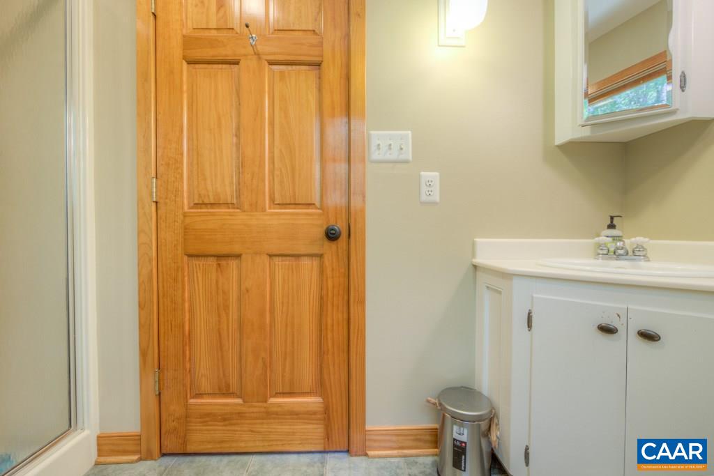 2959 Martin Kings Road Charlottesville, VA 22902 - Photo 25 of 44 a bathroom with a sink and a mirror