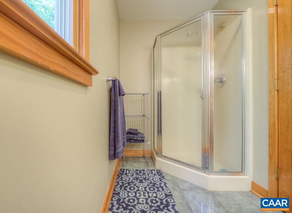 2959 Martin Kings Road Charlottesville, VA 22902 - Photo 26 of 44 a bathroom with a glass door shower