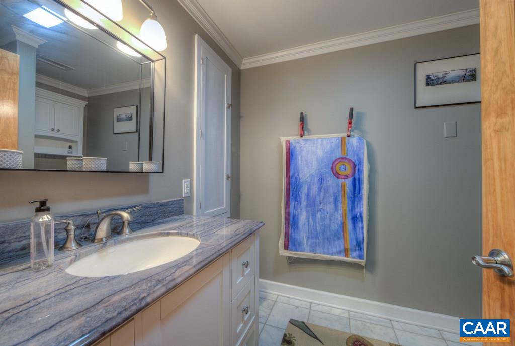 2959 Martin Kings Road Charlottesville, VA 22902 - Photo 31 of 44 a bathroom with a granite countertop sink and a mirror