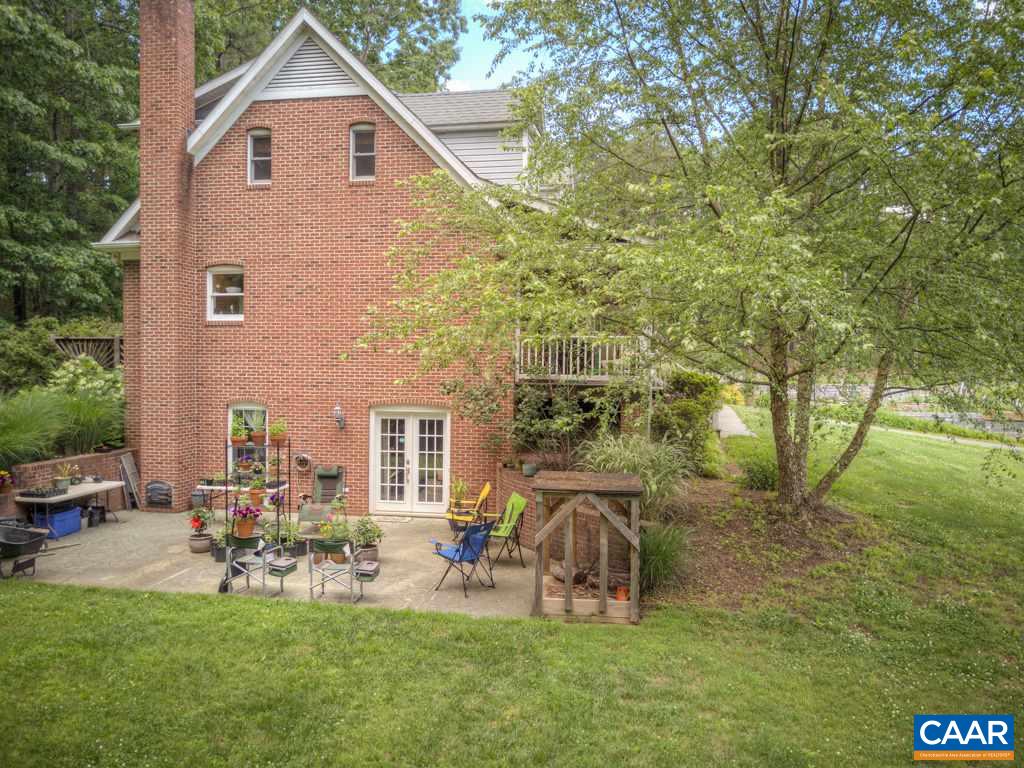 2959 Martin Kings Road Charlottesville, VA 22902 - Photo 33 of 44 a backyard of a house with table and chairs