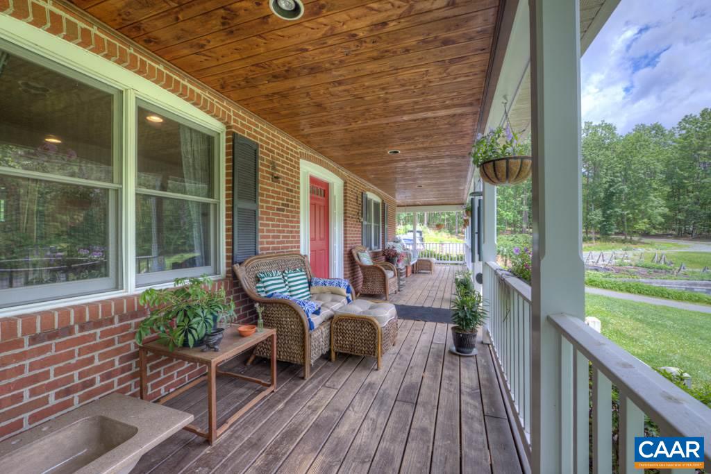 2959 Martin Kings Road Charlottesville, VA 22902 - Photo 4 of 44 a balcony with furniture and wooden floor