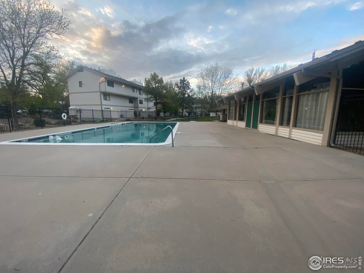 1705 Heatheridge Road, Unit H301 Fort Collins, CO 80526 - Photo 12 of 32 a view of a house with a big yard and large tree
