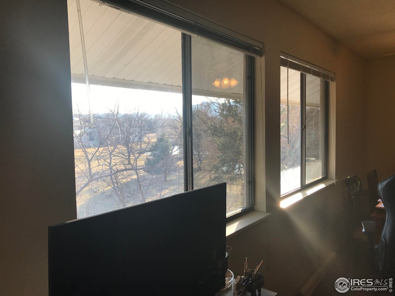 1705 Heatheridge Road, Unit H301 Fort Collins, CO 80526 - Photo 18 of 32 a view of a large window with wooden floor