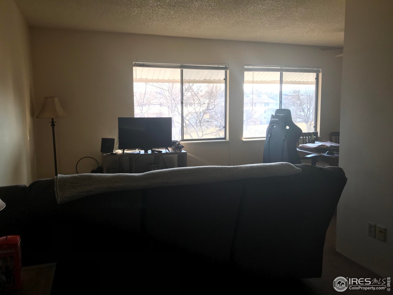 1705 Heatheridge Road, Unit H301 Fort Collins, CO 80526 - Photo 21 of 32 a living room with furniture and large windows