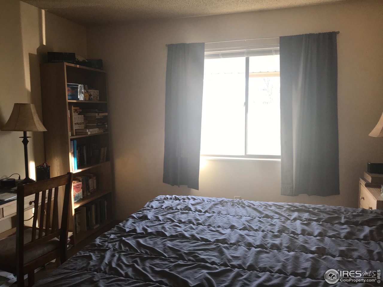 1705 Heatheridge Road, Unit H301 Fort Collins, CO 80526 - Photo 22 of 32 a bedroom with bed and window