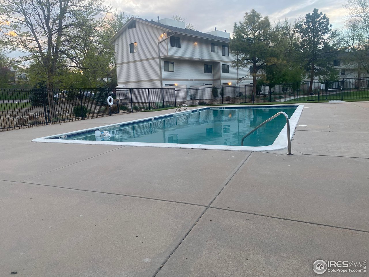 1705 Heatheridge Road, Unit H301 Fort Collins, CO 80526 - Photo 7 of 32 a view of a house with a swimming pool