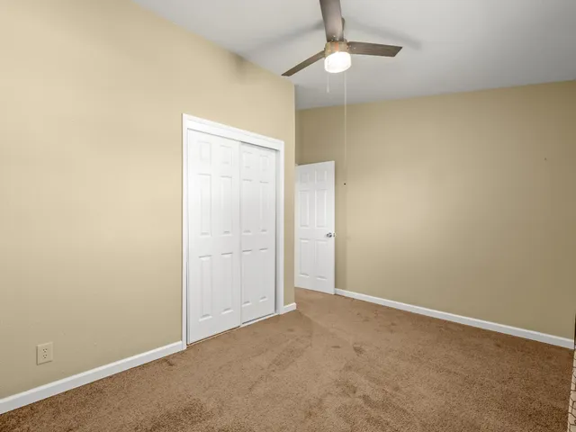 a bathroom with a toilet a sink and a mirror