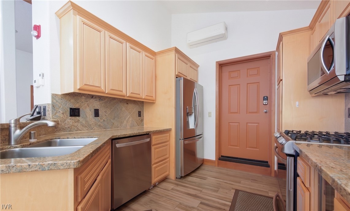 400 Fairview Boulevard, Unit 162 Incline Village, NV 89451 - Photo 11 of 50 a kitchen with stainless steel appliances granite countertop a sink stove and refrigerator