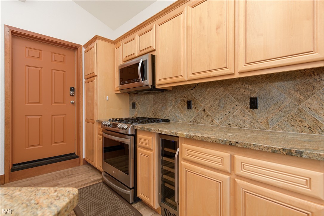 400 Fairview Boulevard, Unit 162 Incline Village, NV 89451 - Photo 12 of 50 a kitchen with stainless steel appliances granite countertop a stove a sink and a microwave