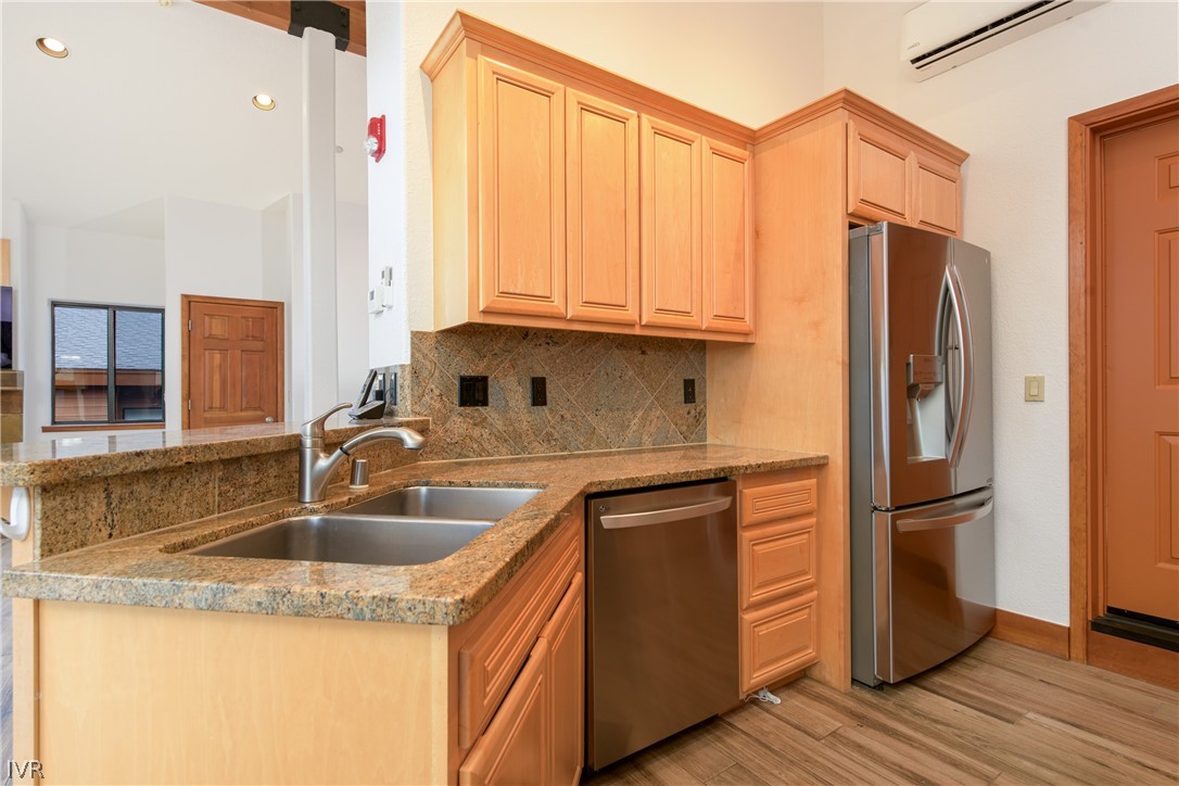 400 Fairview Boulevard, Unit 162 Incline Village, NV 89451 - Photo 14 of 50 a kitchen with stainless steel appliances granite countertop a refrigerator and a sink