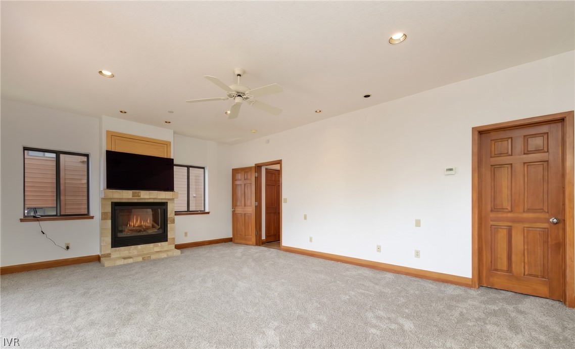 400 Fairview Boulevard, Unit 162 Incline Village, NV 89451 - Photo 17 of 50 an empty room with a fireplace and flat screen tv