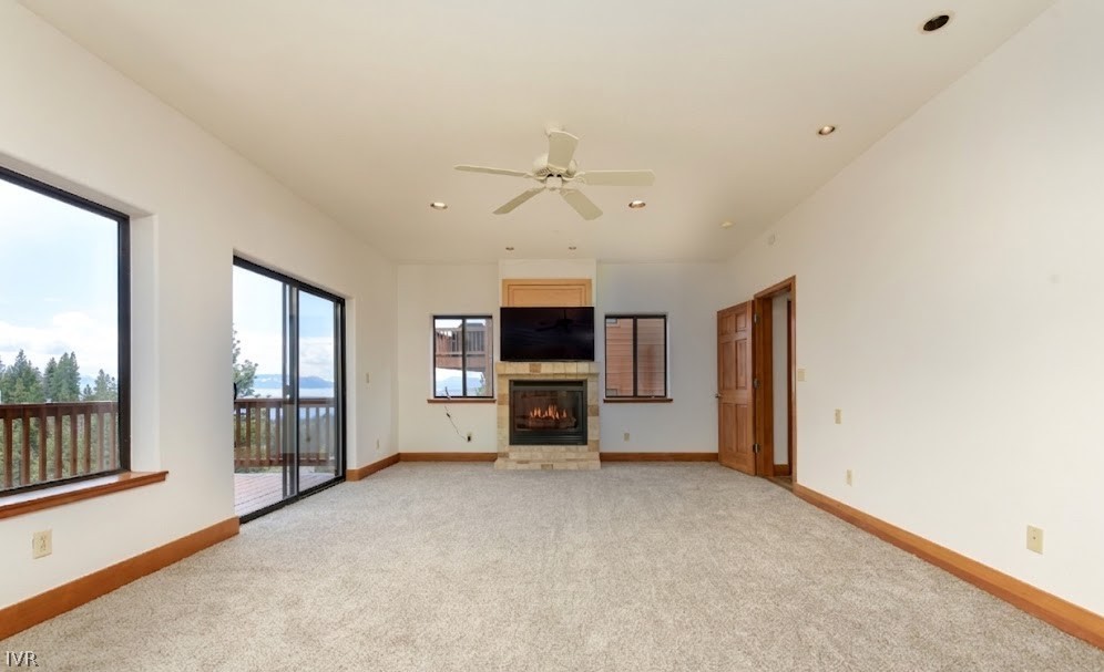 400 Fairview Boulevard, Unit 162 Incline Village, NV 89451 - Photo 18 of 50 an empty room with windows and fireplace