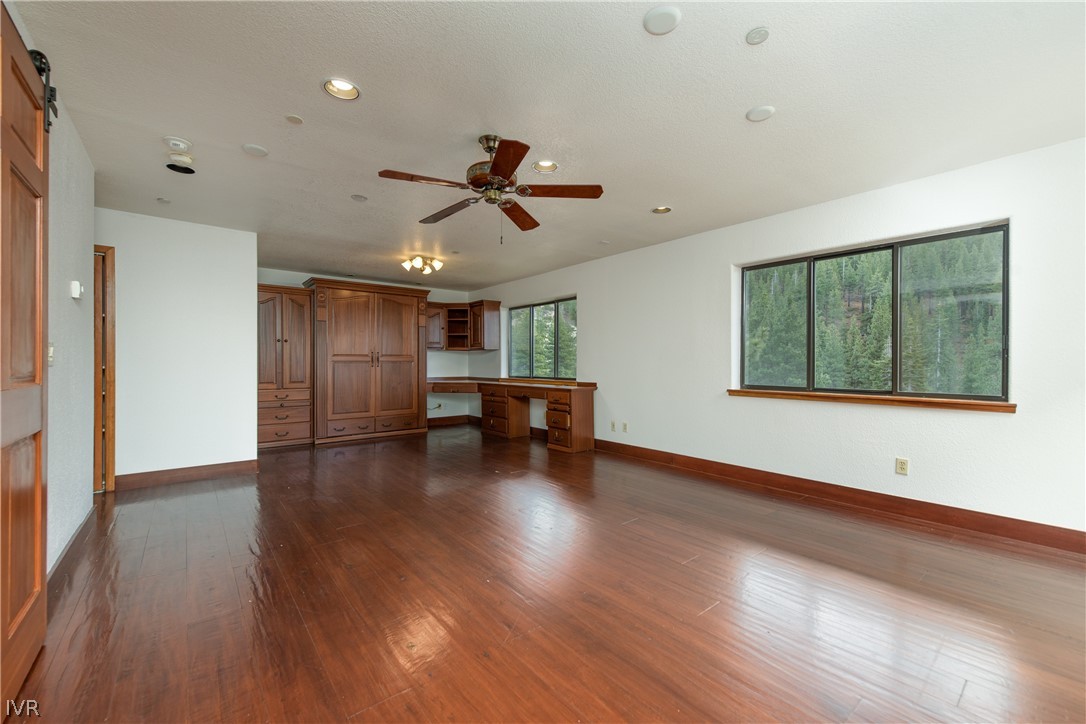 400 Fairview Boulevard, Unit 162 Incline Village, NV 89451 - Photo 27 of 50 a view of a livingroom with wooden floor and a ceiling fan