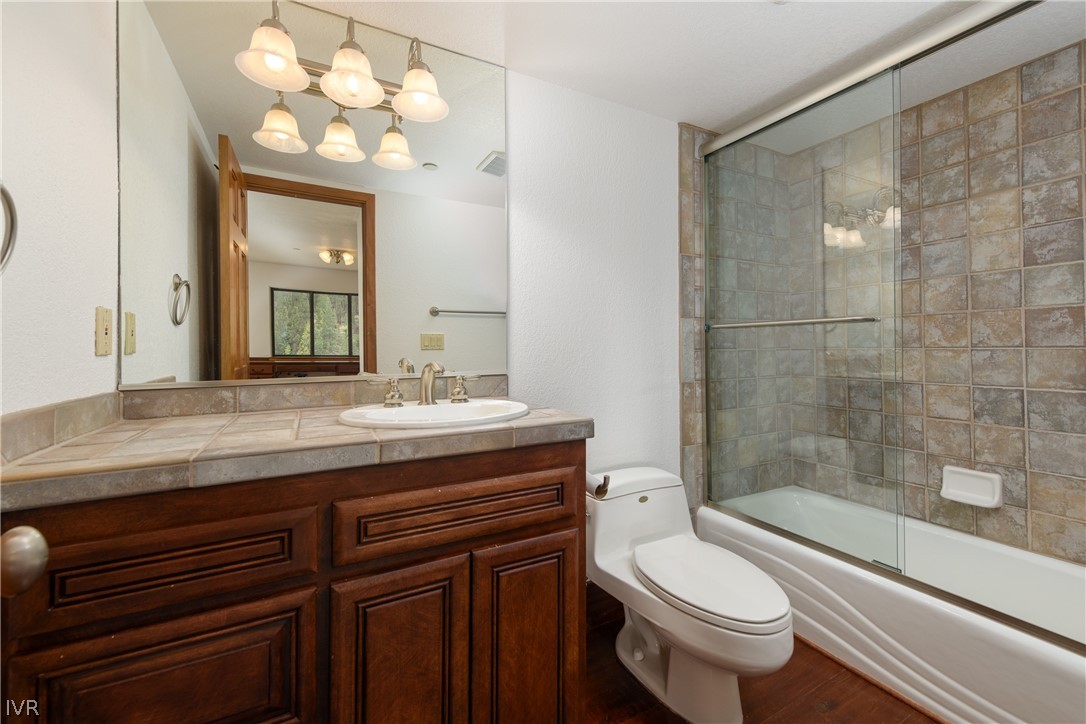 400 Fairview Boulevard, Unit 162 Incline Village, NV 89451 - Photo 29 of 50 a bathroom with a granite countertop sink toilet a mirror and shower