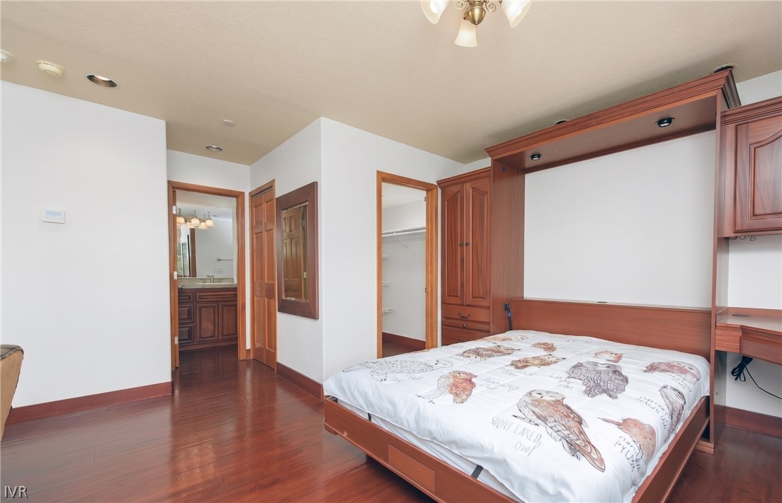 400 Fairview Boulevard, Unit 162 Incline Village, NV 89451 - Photo 31 of 50 a bedroom with a bed and a chandelier