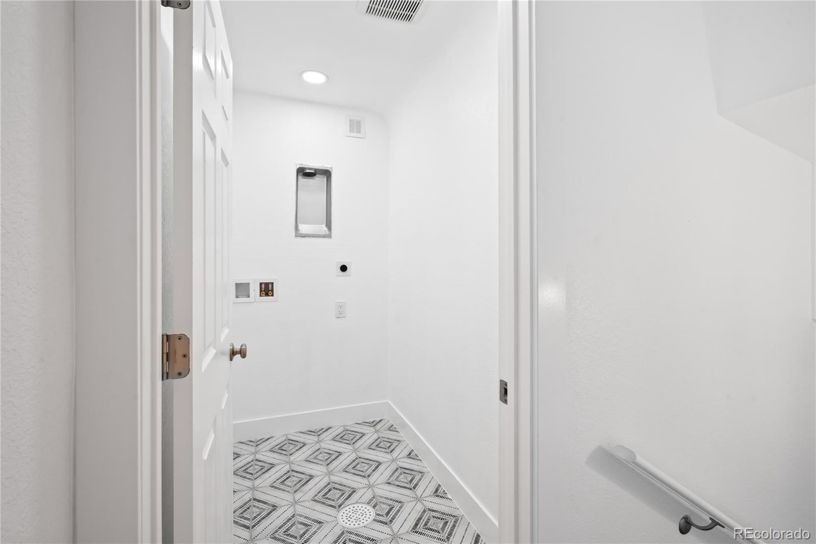 7921 Raleigh Street Westminster, CO 80030 - Photo 19 of 43 a bathroom with a shower and a sink