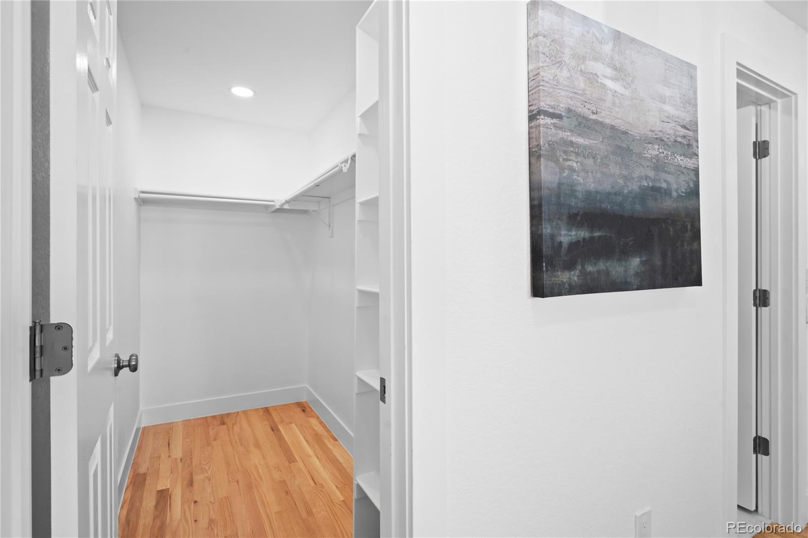 7921 Raleigh Street Westminster, CO 80030 - Photo 26 of 43 a view of a hallway with a small yard