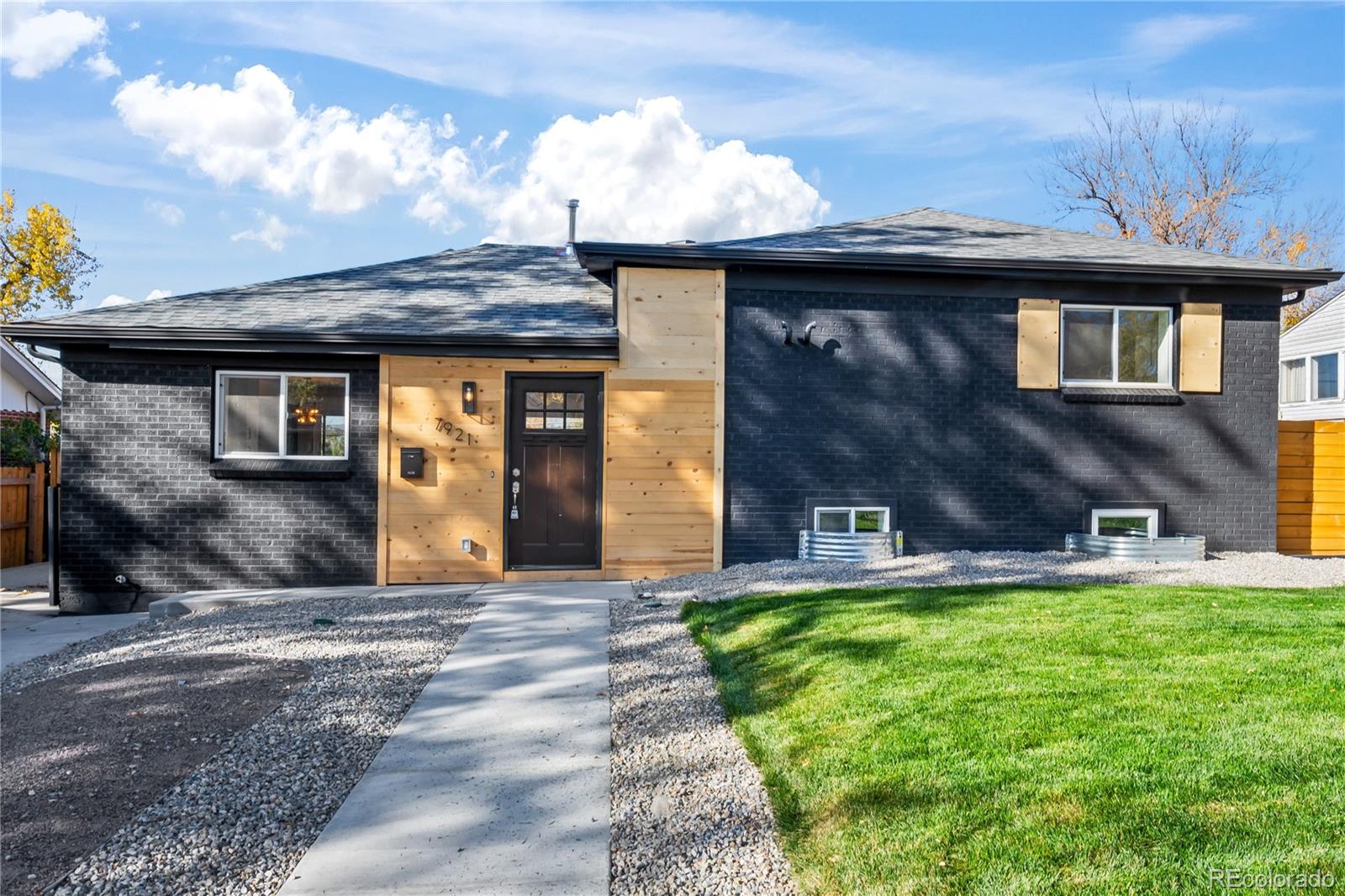 7921 Raleigh Street Westminster, CO 80030 - Photo 4 of 43 a front view of a house with garden