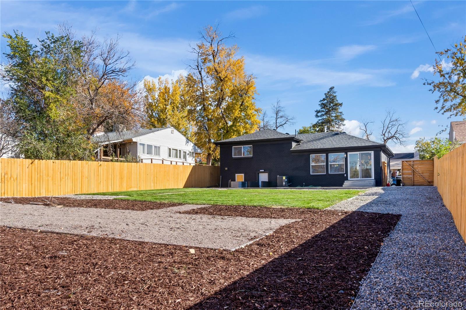 7921 Raleigh Street Westminster, CO 80030 - Photo 43 of 43 a front view of a house with a yard and garage
