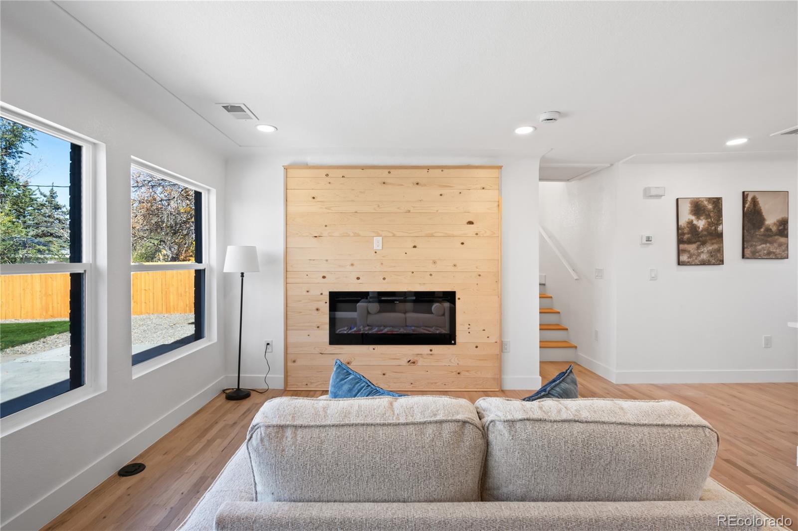7921 Raleigh Street Westminster, CO 80030 - Photo 10 of 43 a living room with furniture and a flat screen tv