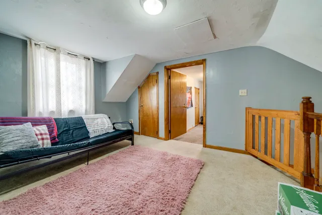 a bedroom with furniture and a window