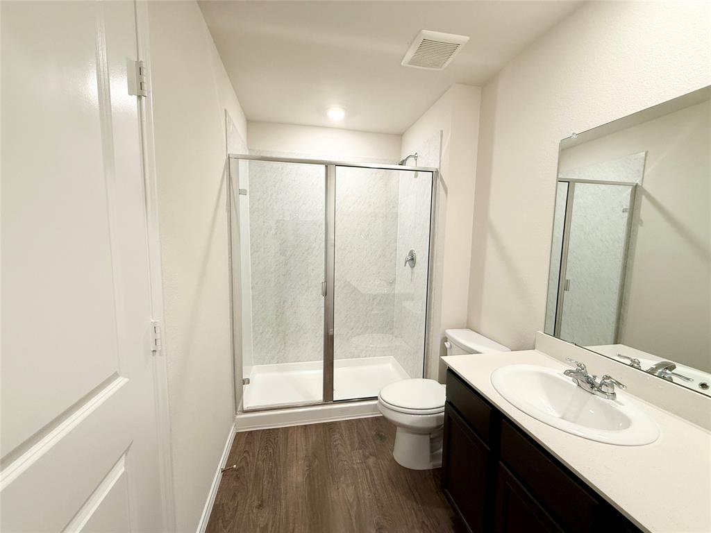 6114 Holly Spg Road Princeton, TX 75407 - Photo 5 of 7 a bathroom with a sink toilet and shower